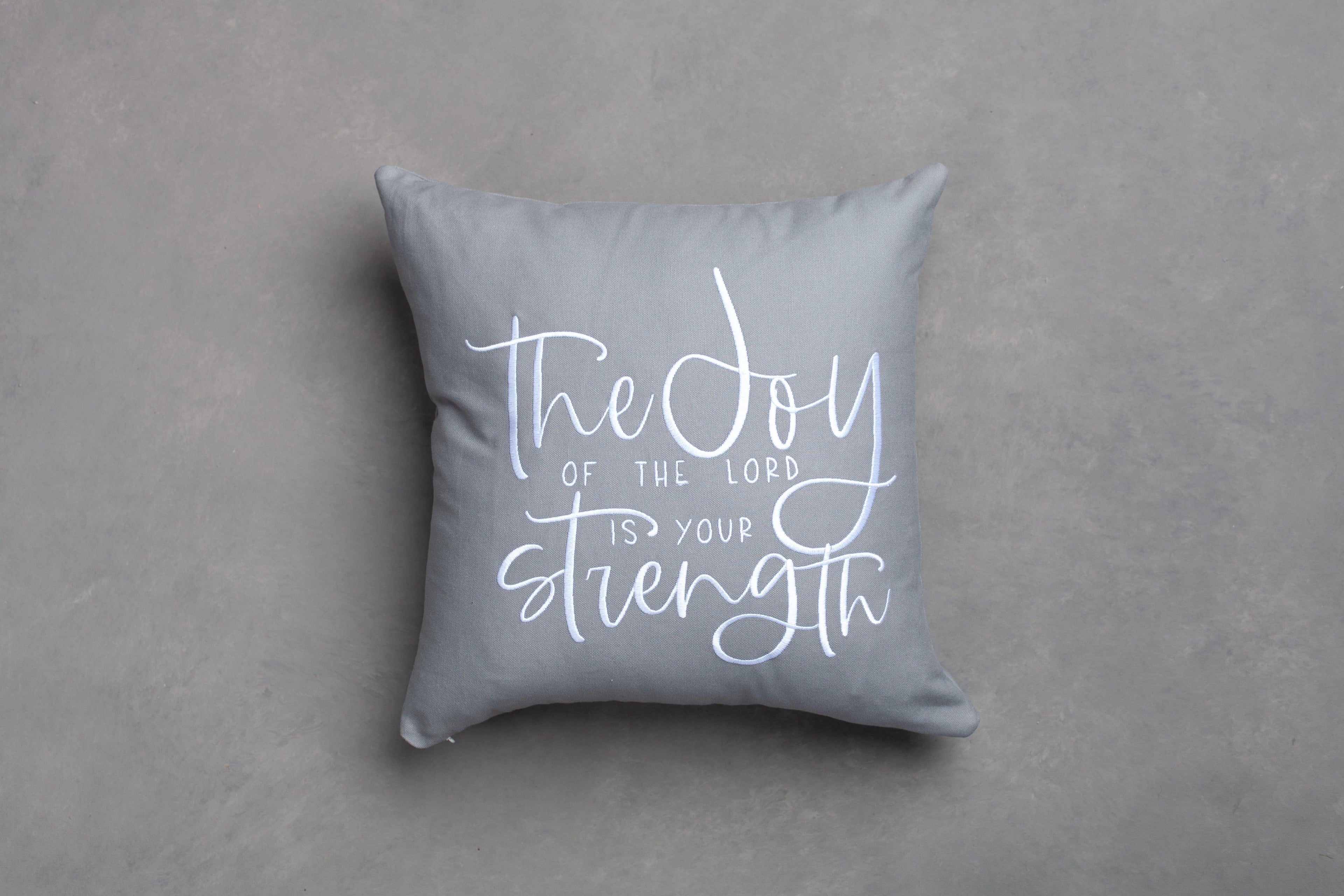 Gray Joy & Strength scripture pillow cover only – embroidered Nehemiah 8:10 Bible verse on neutral grey backdrop for motivational Christian home accents