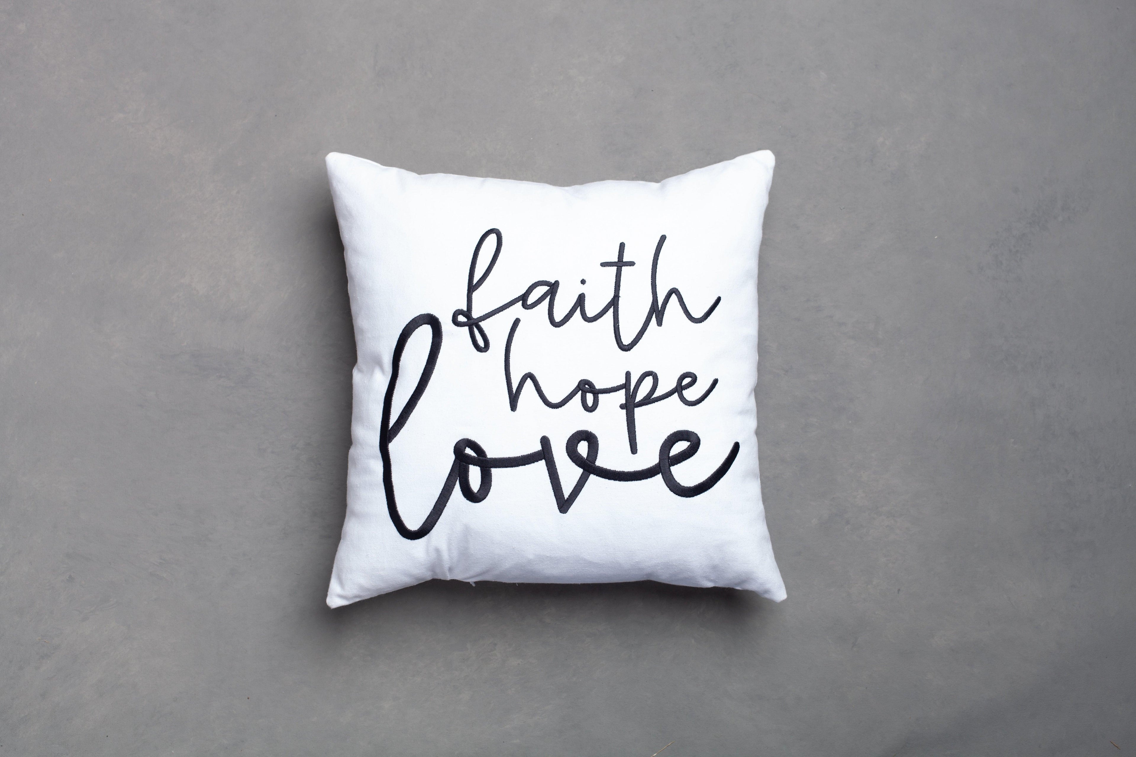 White Faith Hope Love embroidered pillow cover – subtle hand-embroidered 1 Corinthians 13:13 design on clean grey background, removable Christian throw